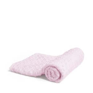 A pink blanket is depicted in this image, with a white background. The blanket appears to be rolled up, and the image is slightly blurry in the background.