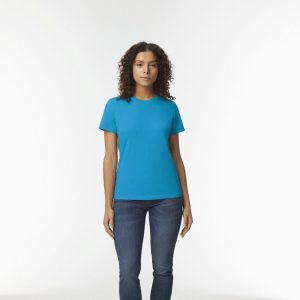 A woman is standing in the image, dressed in a blue T-shirt and blue jeans. The background is white.