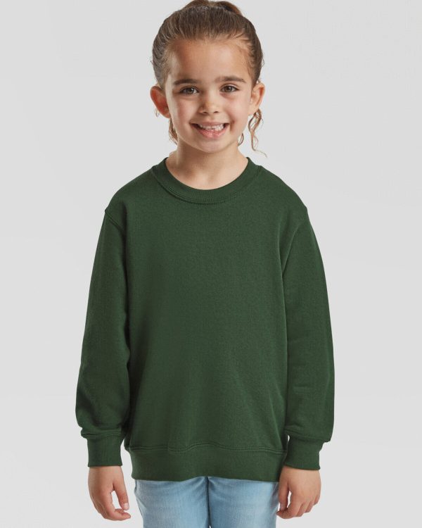 A girl is depicted in this image, wearing a green sweatshirt. The background is white, and the image appears to have been taken in a dimly lit environment.