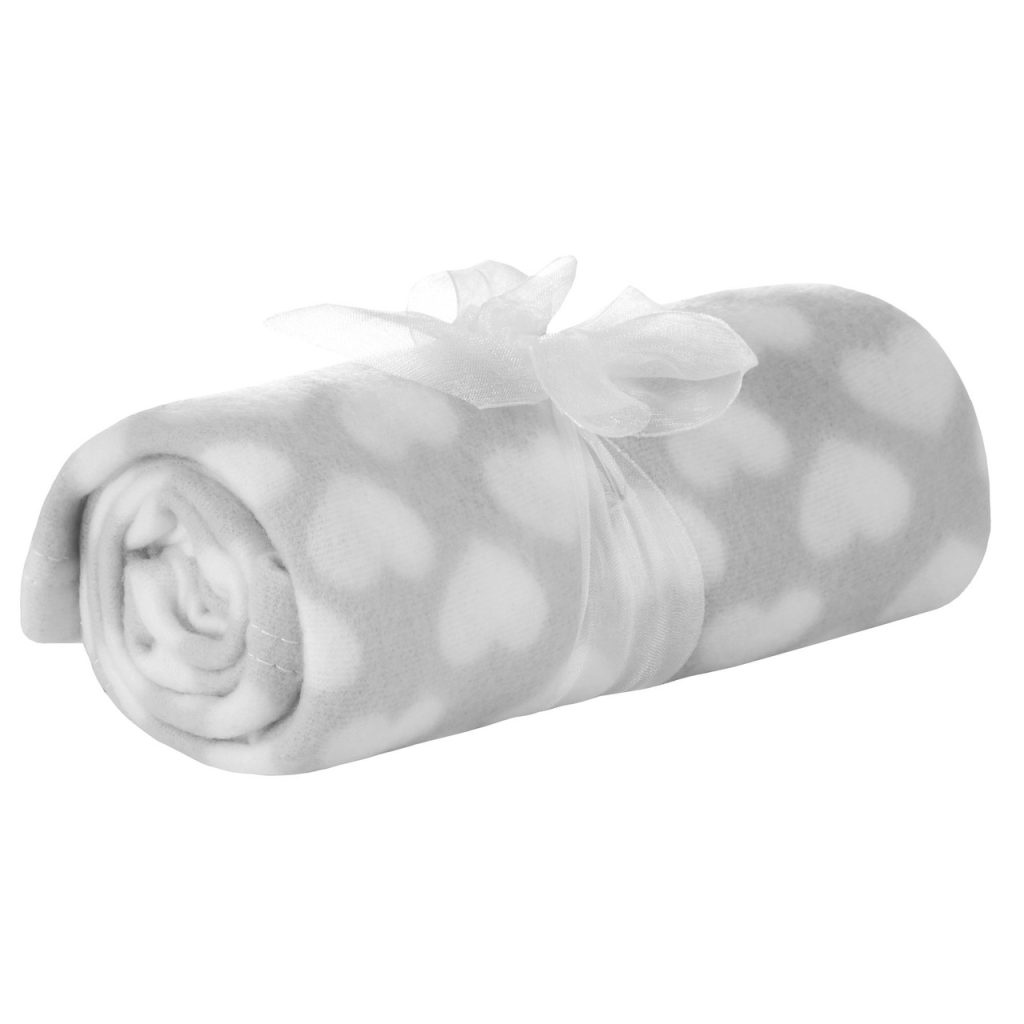 A white and grey blanket is depicted in this image, featuring a design of white and grey hearts. The blanket is neatly rolled up, and a white ribbon is tied around it.