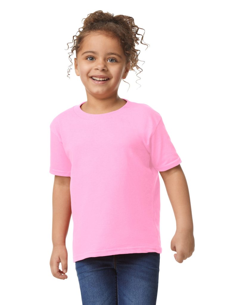 A girl is standing in the image, dressed in a pink t-shirt. She is smiling and posing for the camera. The background is white.