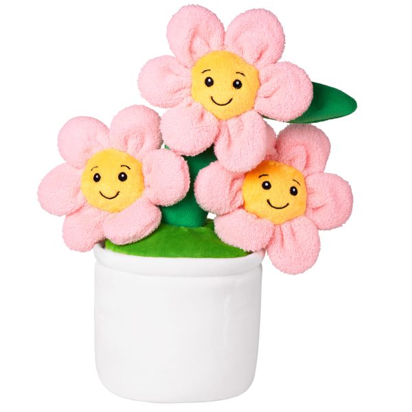 A white flower pot is depicted in this image, containing three pink flowers with yellow centers and green stems. The background is white, and the image is taken from a top-down perspective.