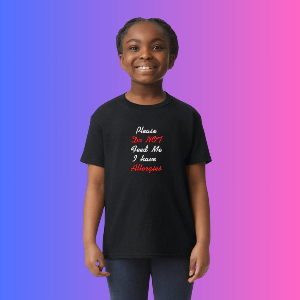 A black t-shirt is displayed in the image, featuring a red and white logo. The background is a mix of blue and pink colors.