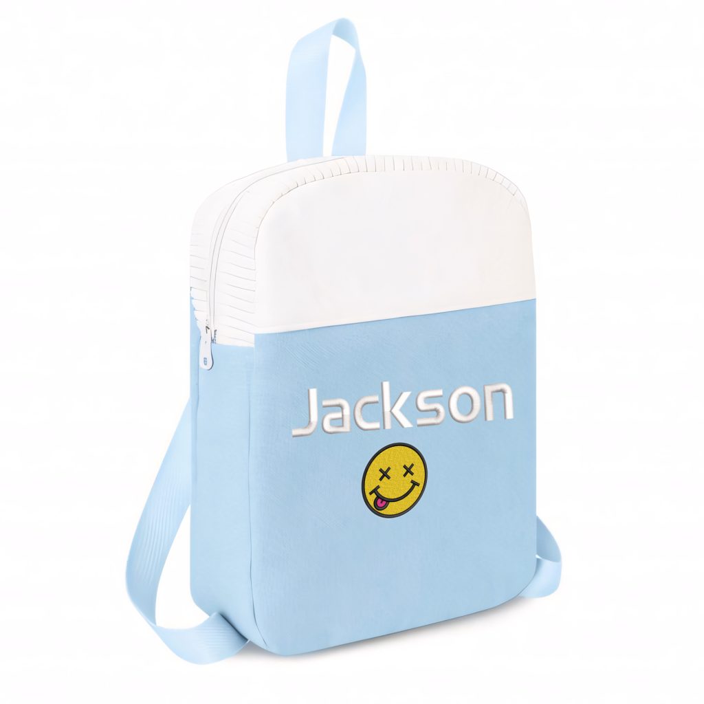 A blue backpack is depicted in this image, featuring a white and blue color scheme. The backpack has a smiley face and the name "jackson" written on it. The background is white.