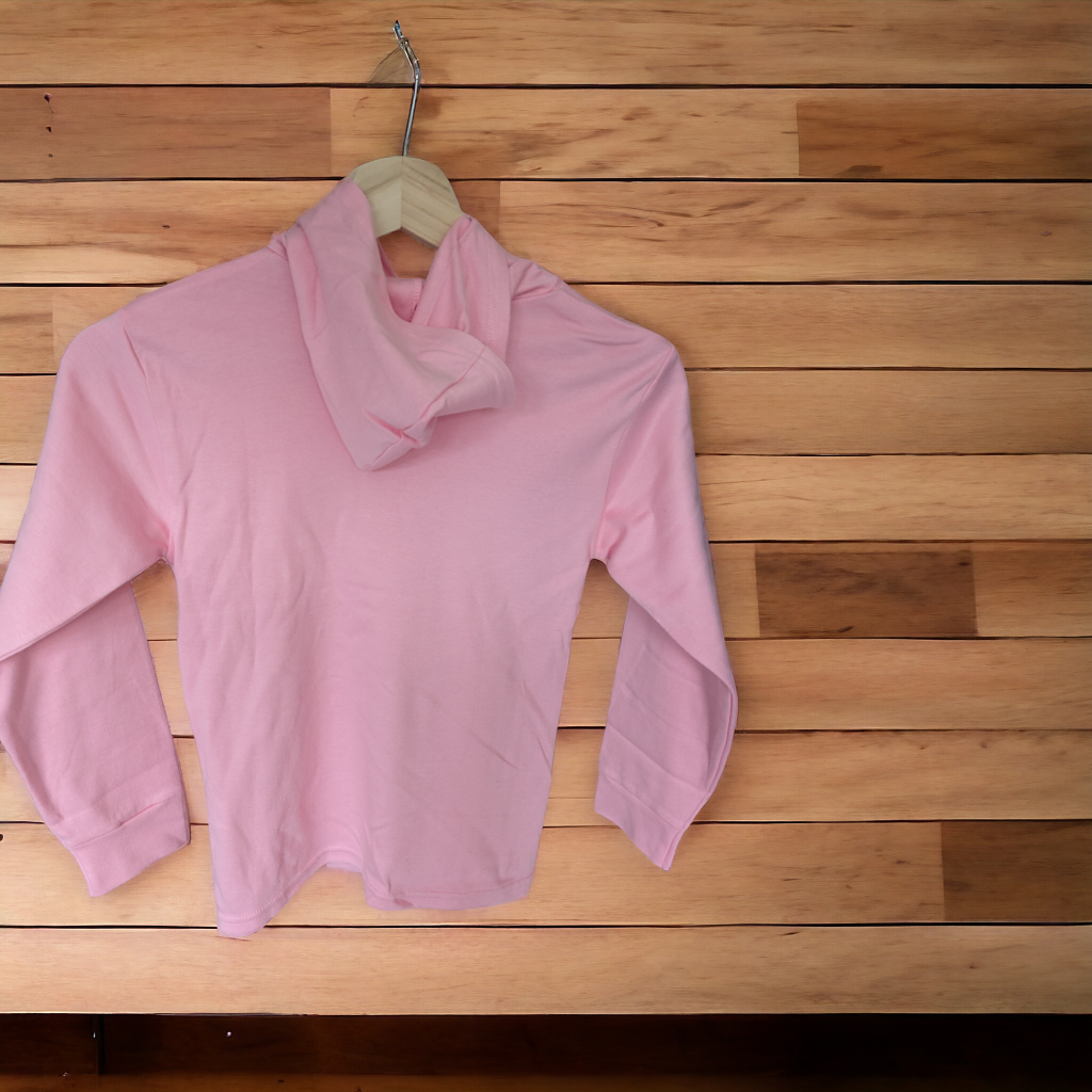 A pink hoodie is displayed in the image, hanging on a hanger. The background features a wooden wall.