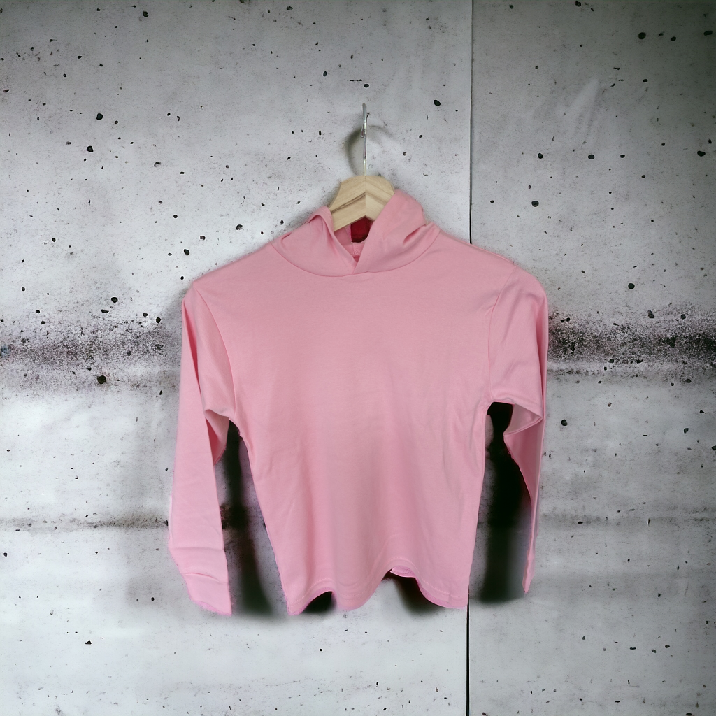 A pink hoodie is displayed in the image, hanging on a hanger. The background features a white wall.