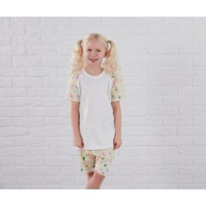 A girl is standing in the image, dressed in a white shirt and shorts with a butterfly print design. The background features a white wall.