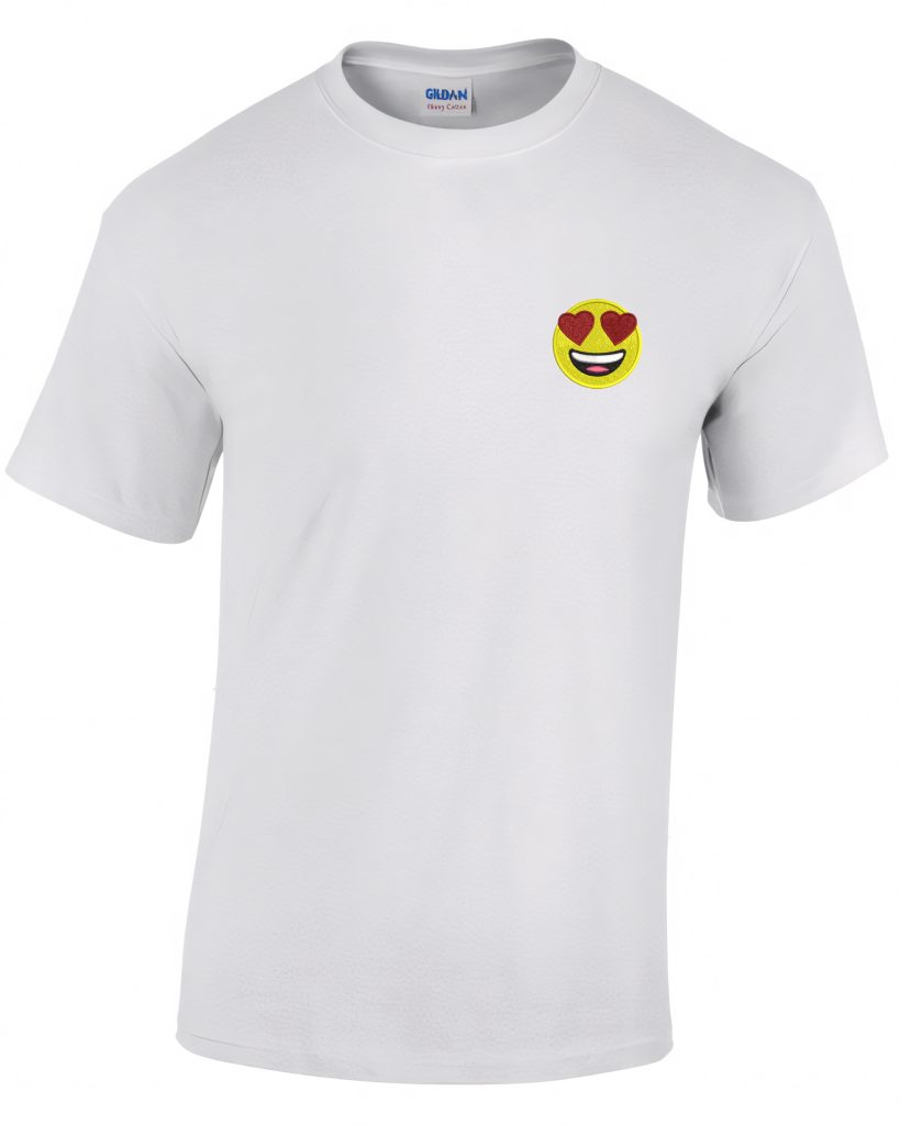 A white t-shirt is the main focus of this image, with a logo and an image of an emoticon face adorning the front. The background is white.