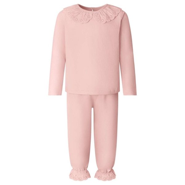 A child is depicted in this image, wearing a pink long-sleeved top and pink pants. The top features a design, while the pants are plain. The background is white.