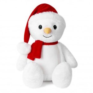 A white teddy bear is the central focus of this image, wearing a red hat and a red scarf. The background is white, and the image is taken from a top-down perspective.