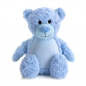 A blue teddy bear is the central focus of this image, with a white background. The bear is adorned with a blue ribbon.