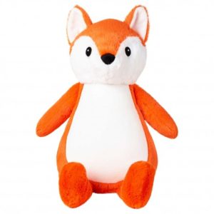 A stuffed animal fox is the central focus of this image, with a white background. The image is taken from a top-down perspective, with the fox in the center and a white background in the background.
