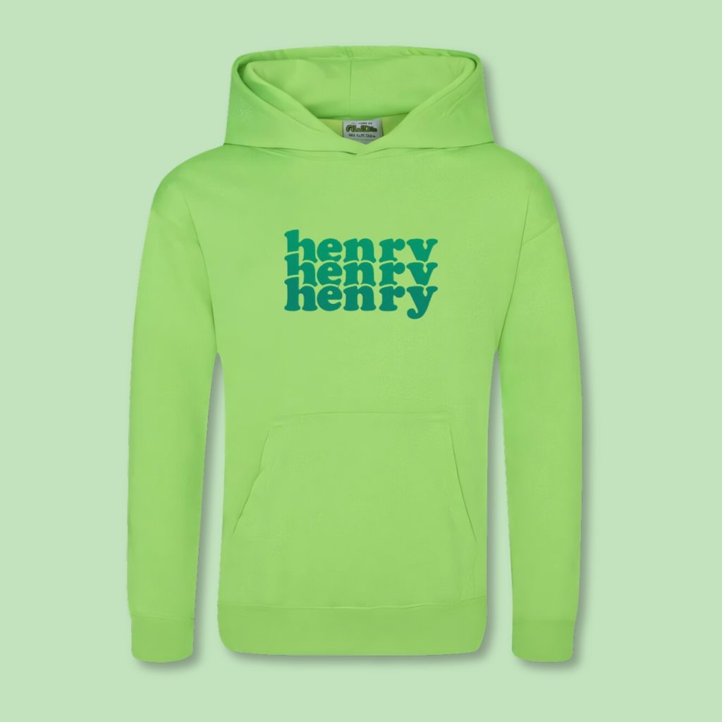 A green hoody with the name "henry" written in blue letters is displayed in the image. The hood is green