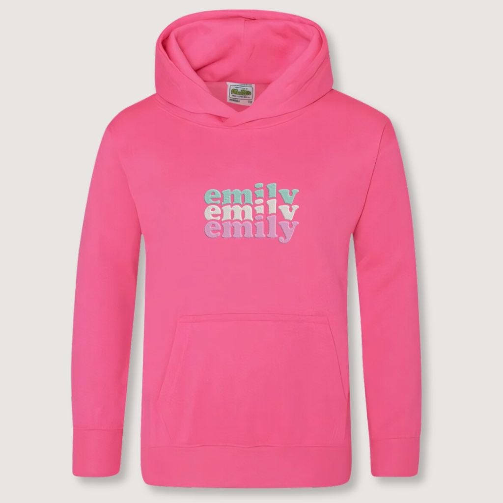 A kids pink hoodie is depicted in this image with the name emily tiple embroidered