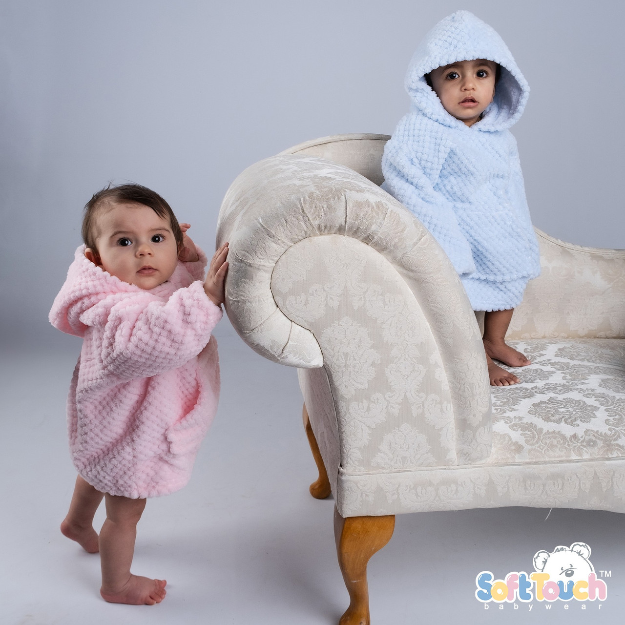 Soft white waffle baby hoodie with a plush texture and a cute design